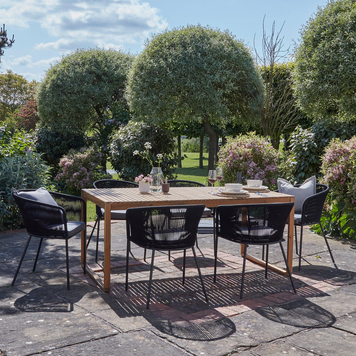 Lennox Table with 6 Black Hali Dining Chairs — garden dining set from 2nd Time Around